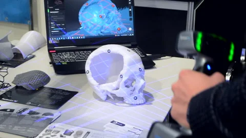 Man 3d scanner 3d scanning plastic prototype human skull printed on 3d printer Stock Footage 328909699