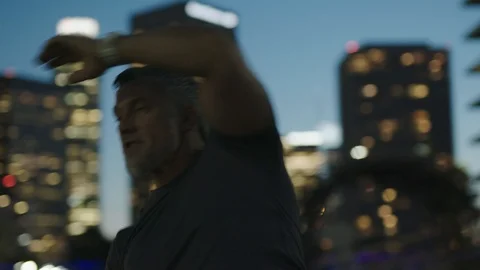 Man 50's working out on night streets in Downtown Los Angeles Stock-Footage 103714579