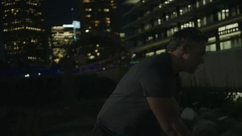 Man 50's working out on night streets in Downtown Los Angeles Stock-Footage 103716752