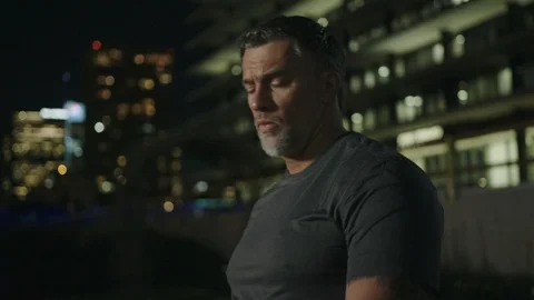 Man 50's working out on night streets in Downtown Los Angeles Stock Footage 103718710