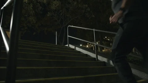 Man 50's working out on night streets in Downtown Los Angeles Video stock 103719287