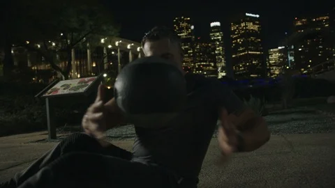 Man 50's working out on night streets in Downtown Los Angeles Stock Footage 103719460