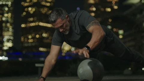 Man 50's working out on night streets in Downtown Los Angeles Stock Footage 103722028