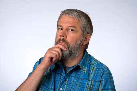 Man 55 years in studio thinking brooding Stock Photos