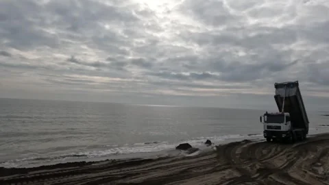 MAN 8x8 Driving Empty with Raised Dump Bed Stock Footage 297492408