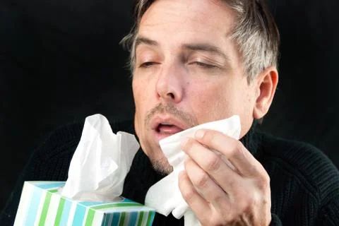 Man about to sneeze Stock Photos
