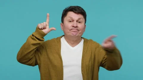 Man abuser showing loser gesture pointing on you, blaming accusing for unsuccess Stock Footage 150532200