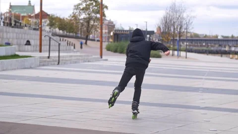 Man accelerates on inline skates in slow motion Stock Footage 120445544