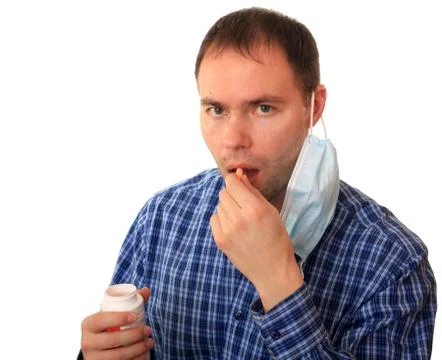 A man accepts vitamins. Stock Photos