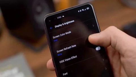 A man is accessing the smartphone settings Stock Footage 145355691