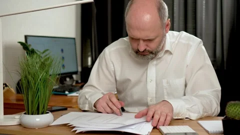 Man accountant working using calculator. businessman analyze company charges Stock Footage 276116645