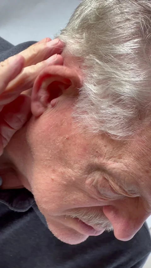 Man with aching ear vertical Video stock 220436758