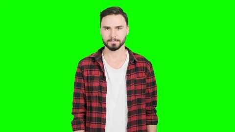 Man acting discretely upset and not happy on green screen. Stock Footage 101893015