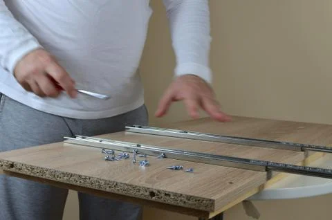 Man in action - installing rails Stock Photos