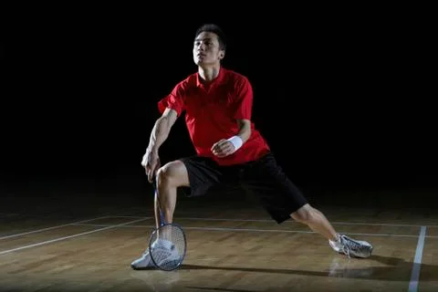 Man In Action Playing Badminton Stock Photos