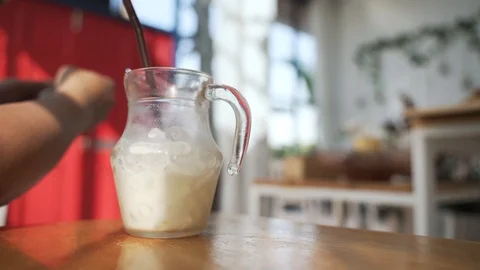 A man addicted to mobile phone while drinking milk Video stock 121096656