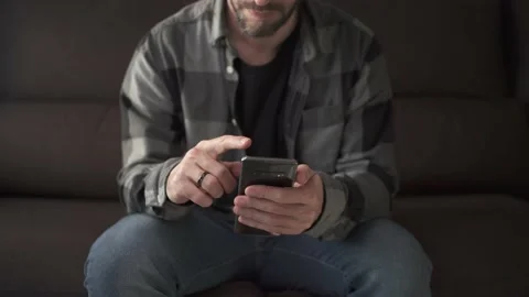 A man addicted to smart phone, scrolling on the screen Stock Footage 151423721