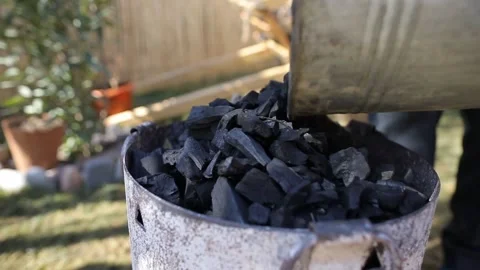 Man Adding Coal to Oven for Prepare to fire Stock Footage 239328900