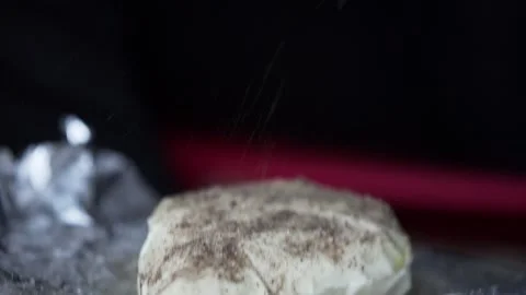 A man adding herbs to a Paneer Stock Footage 132996315