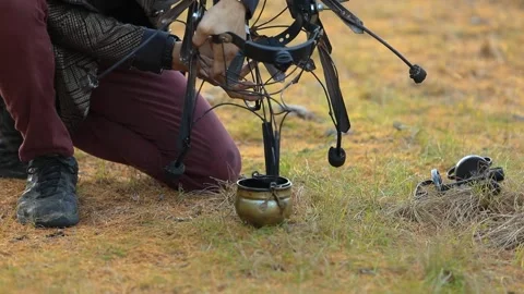 Man adding paraffin wax to metal horn Stock Footage 145015529