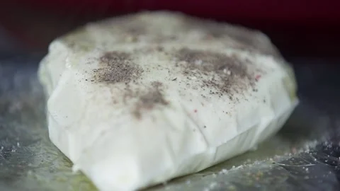 A man adding pepper to a Paneer Stock Footage 132996257