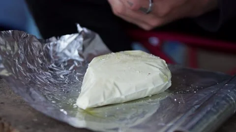 A Man adding salt to a Paneer Stock Footage 132996196