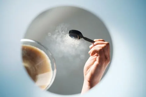 Man Adding Sugar To Coffee Viewed From Inside A Mug Stock Photos