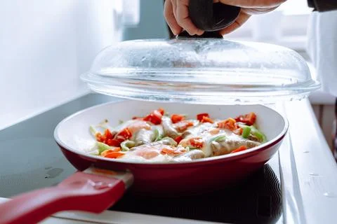 Man with adjustable elbow brace preparing food Stock Photos