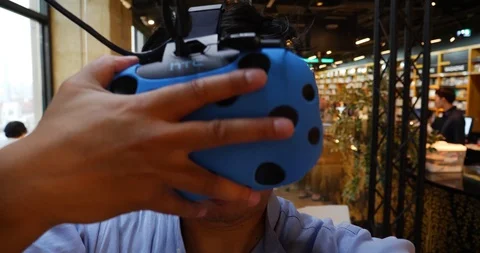 Man adjusting 360 vr goggles front view Stock Footage 89924703