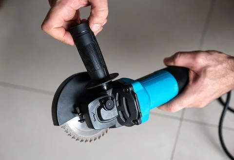 Man Adjusting Angle Grinder Guard, Safety. Setup Photo Stock Photos