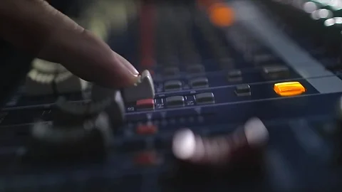 Man adjusting aound an Audio mixer, Working with sound mixing console. Stock Footage 113461254