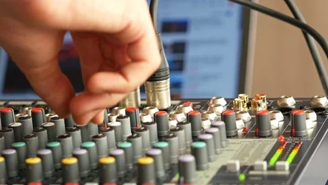 Man adjusting audio mixer in studio with computer screen at background 4K Vídeos de archivo 93645205