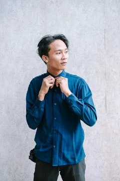 Man Adjusting Collar Stock Photos