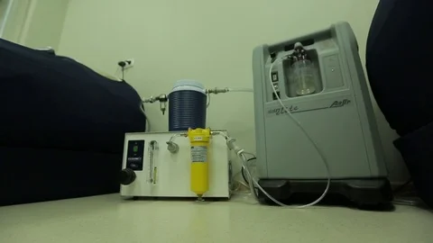 Man adjusting equipment in medical center, altitude camera, shot from the floor Stock Footage