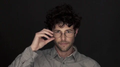 Man adjusting glasses, portrait Stock Footage 75169432