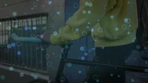 Man adjusting grip and pushing bike along sidewalk for commuting hex layer Stock Footage 333689526
