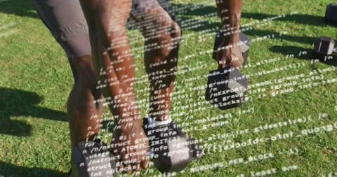 Man adjusting grip doing dumbbell lift on field code overlay partly obscuring Stock Footage 323431010