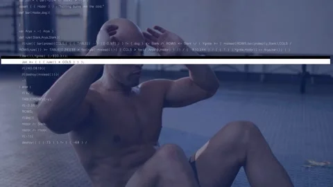 Man adjusting hands and initiating crunches on floor for core training, code Stock Footage 333061770
