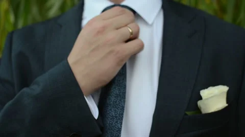 Man adjusting his blue tie Stock Footage 58033716