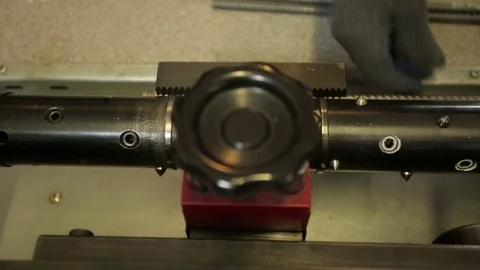 Man adjusting the machine to test the durability of reiforsing steel bars left Stock Footage 72712560
