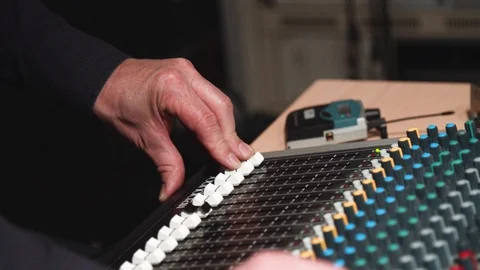 Man adjusting music control surface Stock Footage 108371412
