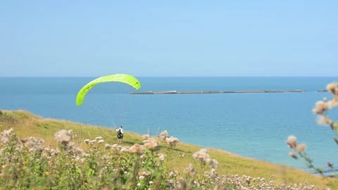 Man Adjusting Paraglider Harness Before Takeoff 库存影片 331415086