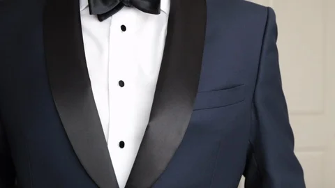 Man adjusting pocket squar from tux slow 스톡 동영상 102773085