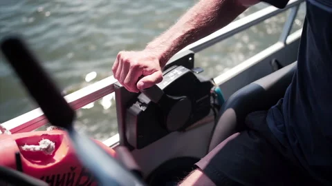 Man Adjusting Power Controls On Powerful Boat 動画素材 146144895