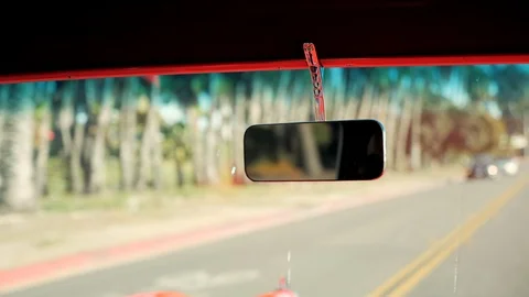 Man Adjusting Rear View Mirror of 1950s Classic Muscle Car Stock Footage 93157058