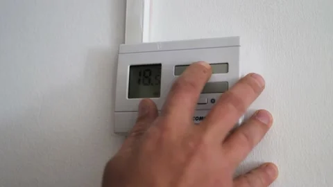 Man adjusting the room temperature Stock Footage 161570349