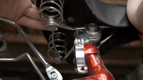 Man Adjusting The Seat On His Spin Bike. Stock Footage 123706296