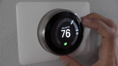Man Adjusting Smart Thermostat Gadget At Home Stock Footage 120892314