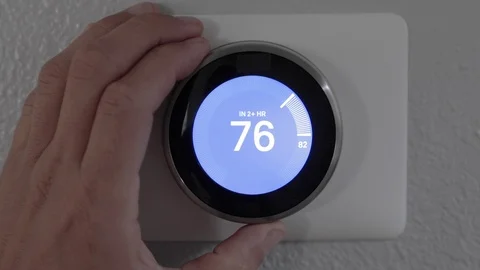 Man Adjusting Smart Thermostat Gadget At Home Stock Footage 120892331