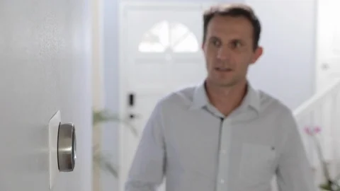Man Adjusting Smart Thermostat Gadget At Home Stock Footage 120892671